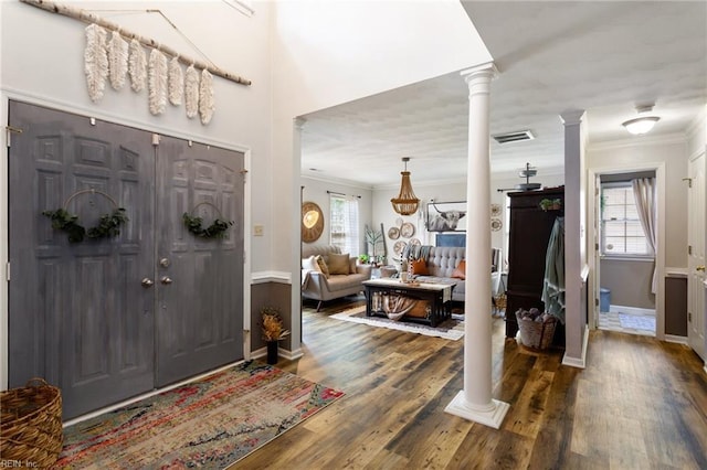 2820 Crossings Dr, Chesapeake, VA 23321 - entryway with decorative columns, crown molding, plenty of natural light, and wood finished floors
