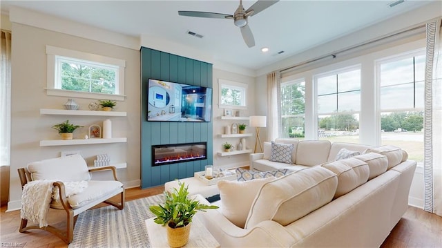 913 Jennings Ln, Chesapeake, VA 23322 - living area featuring a ceiling fan, a large fireplace, wood finished floors, built in features, and recessed lighting