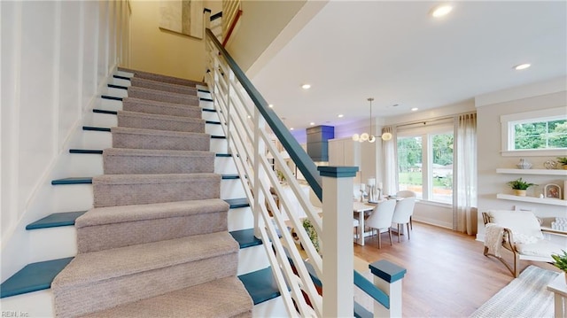 913 Jennings Ln, Chesapeake, VA 23322 - staircase with recessed lighting, wood finished floors, a chandelier, and baseboards