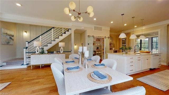 913 Jennings Ln, Chesapeake, VA 23322 - dining room featuring stairway, light wood finished floors, a chandelier, recessed lighting, and baseboards