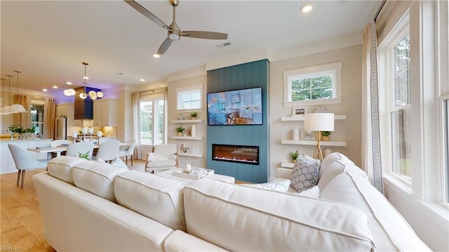 909 Jennings Ln, Chesapeake, VA 23322 - living room featuring plenty of natural light, a ceiling fan, a fireplace, and recessed lighting