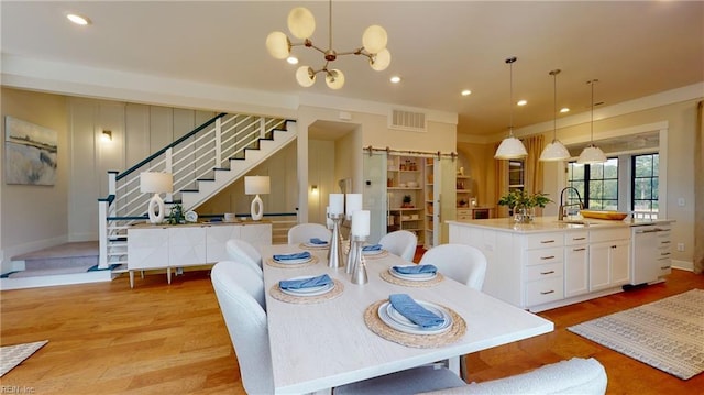 909 Jennings Ln, Chesapeake, VA 23322 - dining space featuring stairs, light wood finished floors, recessed lighting, a chandelier, and baseboards