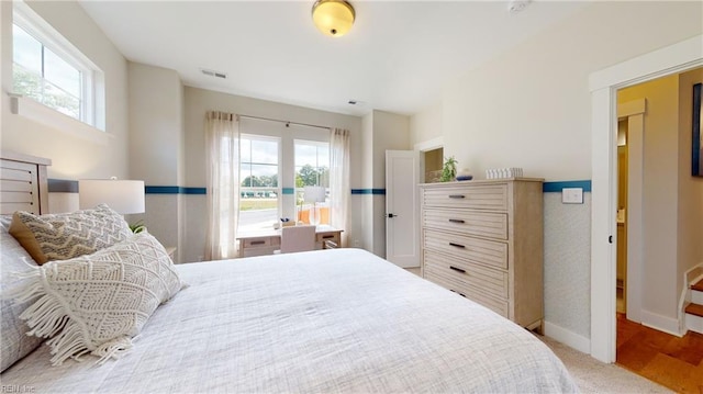 909 Jennings Ln, Chesapeake, VA 23322 - carpeted bedroom featuring baseboards and access to exterior