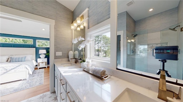 909 Jennings Ln, Chesapeake, VA 23322 - ensuite bathroom with double vanity, a tile shower, and recessed lighting