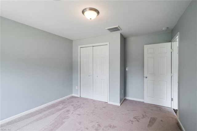 2816 N Nansemond Dr, Suffolk, VA 23435 - unfurnished bedroom featuring carpet flooring, a closet, and baseboards