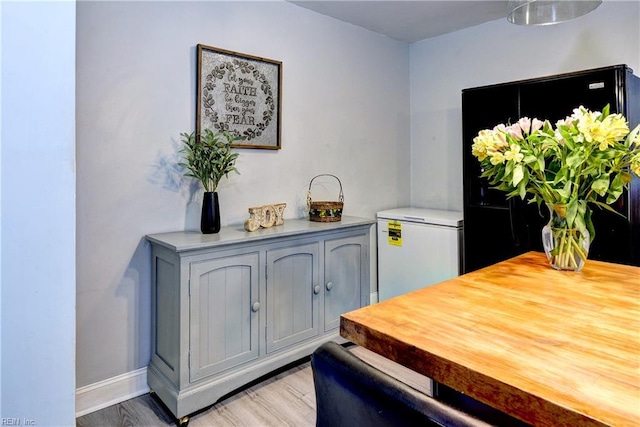 115 Bowen Dr, Hampton, VA 23666 - kitchen featuring white fridge, light wood-style floors, and light countertops