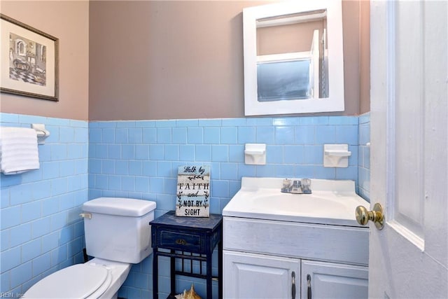 115 Bowen Dr, Hampton, VA 23666 - half bathroom with vanity, tile walls, and wainscoting