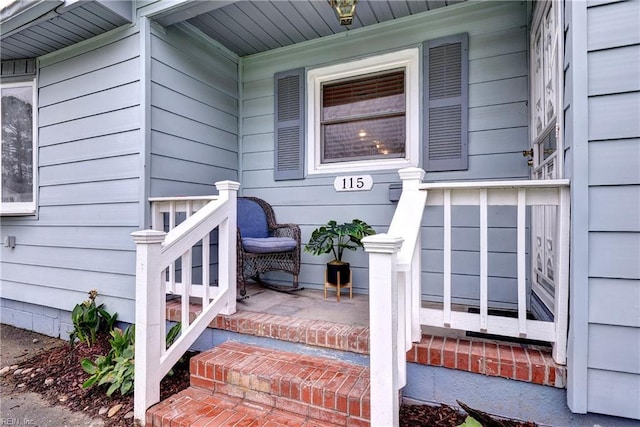 115 Bowen Dr, Hampton, VA 23666 - view of exterior entry with a porch