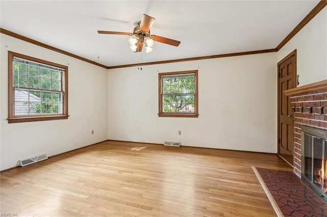 122 Avery Cres, Newport News, VA 23606 - unfurnished living room with light wood-style flooring, a fireplace, crown molding, and a ceiling fan