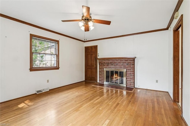 122 Avery Cres, Newport News, VA 23606 - unfurnished living room featuring hardwood / wood-style flooring, a ceiling fan, a brick fireplace, and crown molding