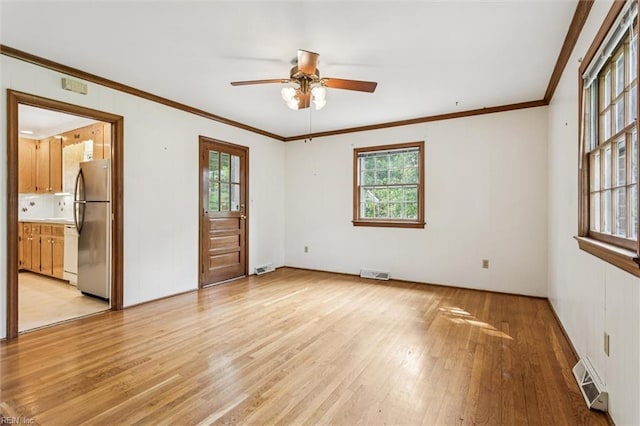122 Avery Cres, Newport News, VA 23606 - spare room featuring light wood finished floors, healthy amount of natural light, a ceiling fan, crown molding, and baseboards