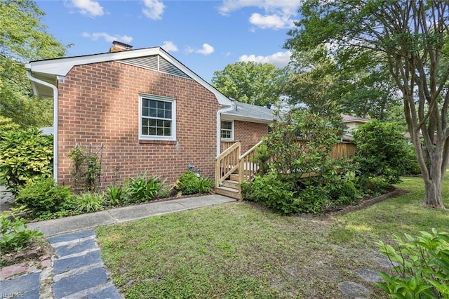 122 Avery Cres, Newport News, VA 23606 - view of front of house featuring a front lawn, brick siding, and a deck