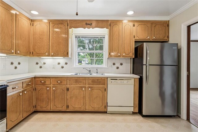 122 Avery Cres, Newport News, VA 23606 - kitchen with dishwasher, freestanding refrigerator, a sink, ornamental molding, and tasteful backsplash