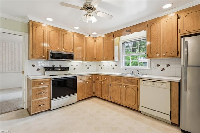 122 Avery Cres, Newport News, VA 23606 - kitchen featuring appliances with stainless steel finishes, a sink, ornamental molding, tasteful backsplash, and light countertops