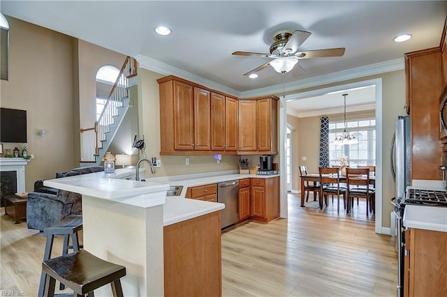 1228 Cherrytree Ln, Chesapeake, VA 23320 - kitchen featuring stainless steel appliances, a sink, a ceiling fan, a peninsula, and a kitchen breakfast bar
