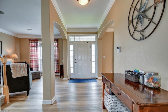 1228 Cherrytree Ln, Chesapeake, VA 23320 - entryway featuring arched walkways, plenty of natural light, crown molding, and light wood-type flooring