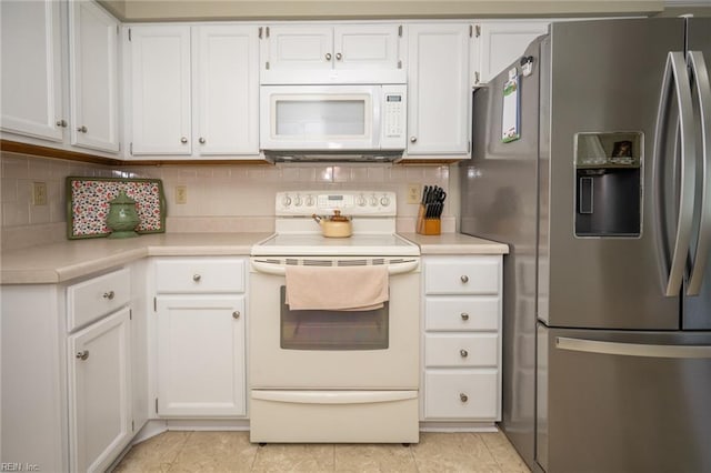 905 Lela Ln, Chesapeake, VA 23322 - kitchen with white appliances, light countertops, decorative backsplash, and white cabinets
