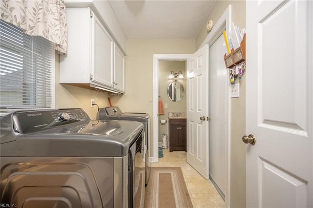 905 Lela Ln, Chesapeake, VA 23322 - laundry room featuring cabinet space, washing machine and clothes dryer, and light tile patterned floors