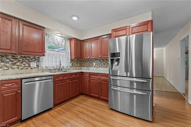 10 Kathy Dr, Poquoson, VA 23662 - kitchen with stainless steel appliances, a sink, light wood finished floors, and plenty of natural light