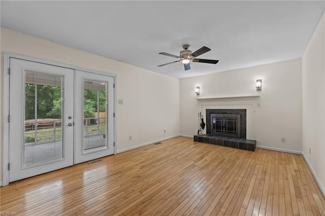 10 Kathy Dr, Poquoson, VA 23662 - unfurnished living room featuring french doors, light wood-type flooring, baseboards, and ceiling fan