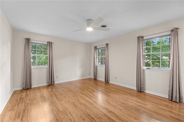 10 Kathy Dr, Poquoson, VA 23662 - empty room featuring a ceiling fan, light wood-style floors, plenty of natural light, and baseboards