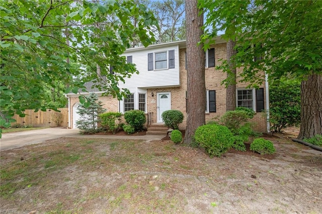 10 Kathy Dr, Poquoson, VA 23662 - view of front facade with brick siding, driveway, and a garage