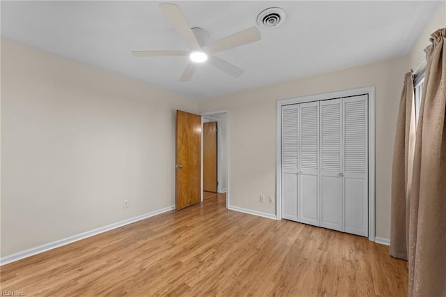 10 Kathy Dr, Poquoson, VA 23662 - unfurnished bedroom featuring light wood-type flooring, baseboards, a closet, and a ceiling fan