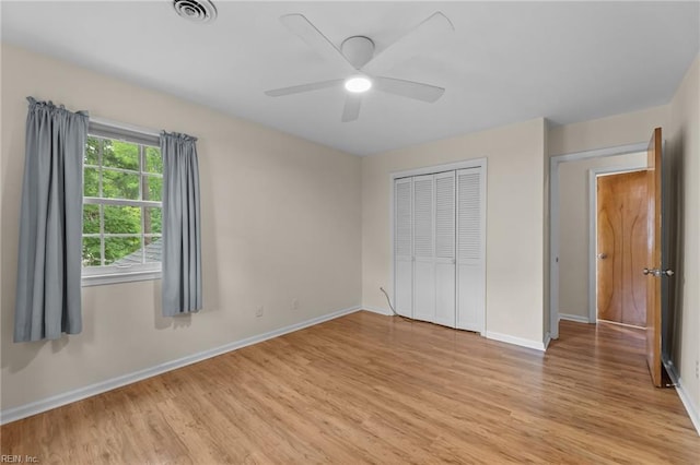 10 Kathy Dr, Poquoson, VA 23662 - unfurnished bedroom featuring light wood-style flooring, baseboards, a closet, and a ceiling fan