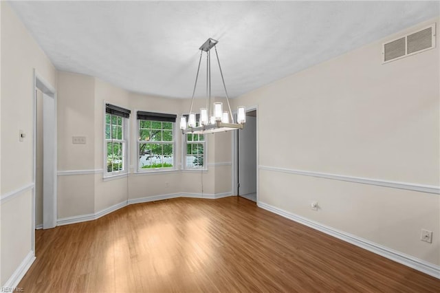 10 Kathy Dr, Poquoson, VA 23662 - unfurnished room featuring a chandelier, wood finished floors, and baseboards