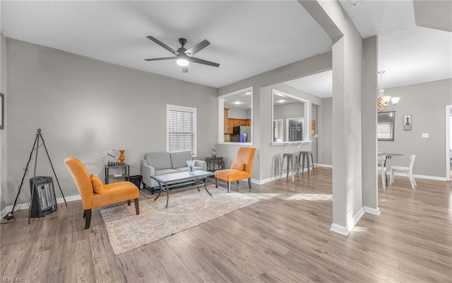 1215 W 27th St, Norfolk, VA 23508 - living area featuring wood finished floors, baseboards, ceiling fan, and a chandelier