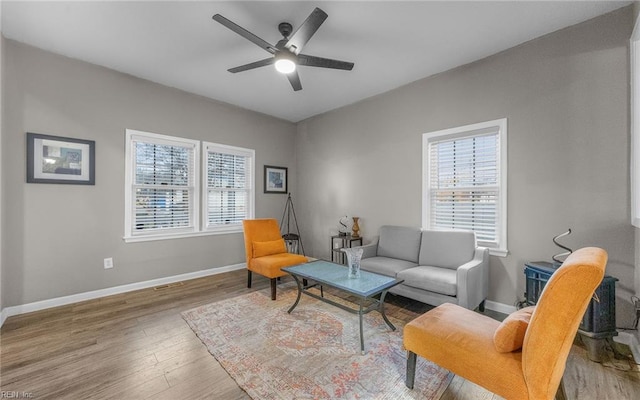 1215 W 27th St, Norfolk, VA 23508 - living room featuring healthy amount of natural light, wood finished floors, baseboards, and a ceiling fan