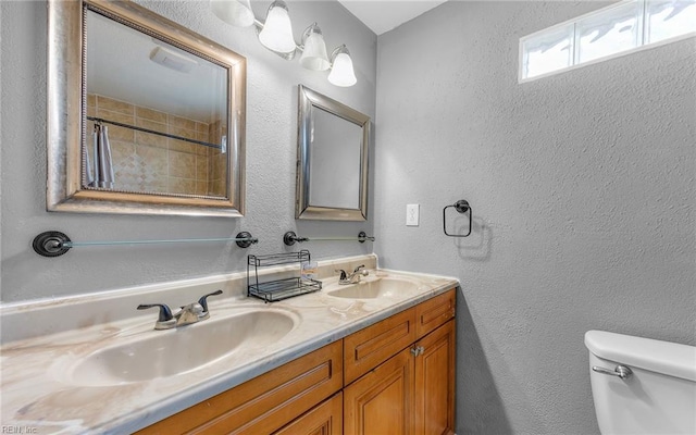 1215 W 27th St, Norfolk, VA 23508 - full bathroom with toilet, double vanity, a textured wall, and a shower with shower curtain
