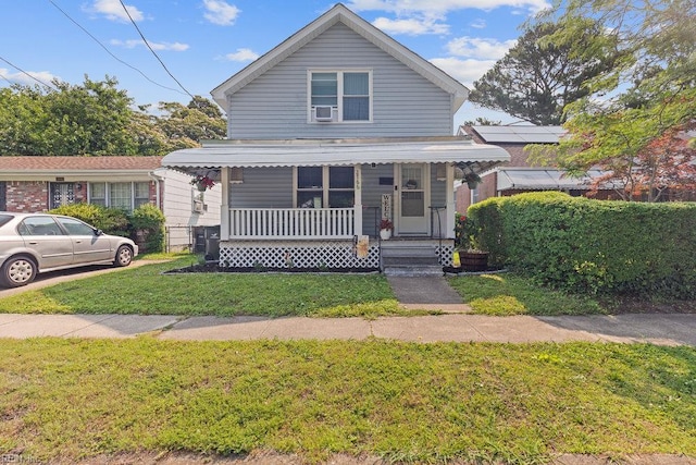 2766 Mckann Ave, Norfolk, VA 23509 - view of front of house with a porch and a front yard
