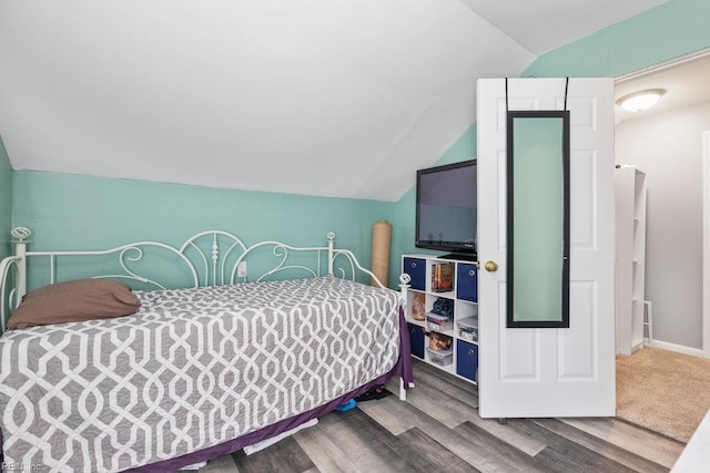 2766 Mckann Ave, Norfolk, VA 23509 - bedroom featuring vaulted ceiling, wood finished floors, and baseboards