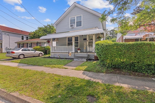 2766 Mckann Ave, Norfolk, VA 23509 - view of front of house featuring a porch and a front yard