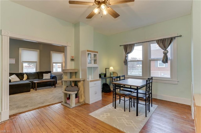 1108 E Pembroke Ave, Hampton, VA 23669 - dining space featuring light wood finished floors, a ceiling fan, and baseboards