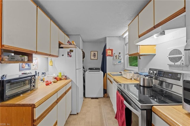 4420 Anderson Ave, Suffolk, VA 23435 - kitchen with stainless steel range with electric stovetop, washer / clothes dryer, freestanding refrigerator, light floors, and wooden counters
