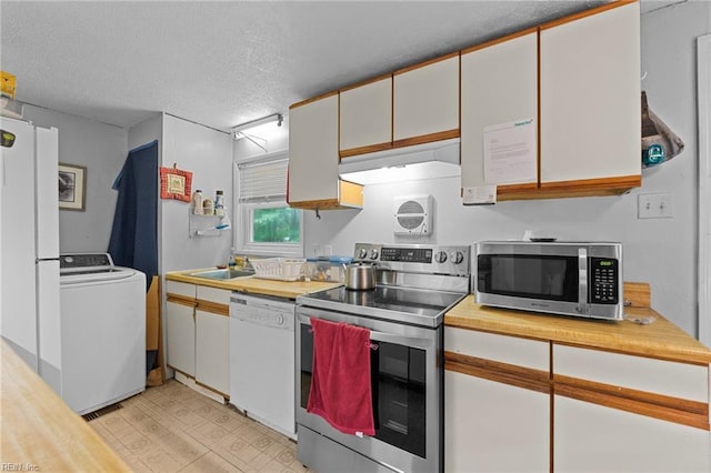 4420 Anderson Ave, Suffolk, VA 23435 - kitchen featuring stainless steel appliances, washer / dryer, under cabinet range hood, a sink, and light floors