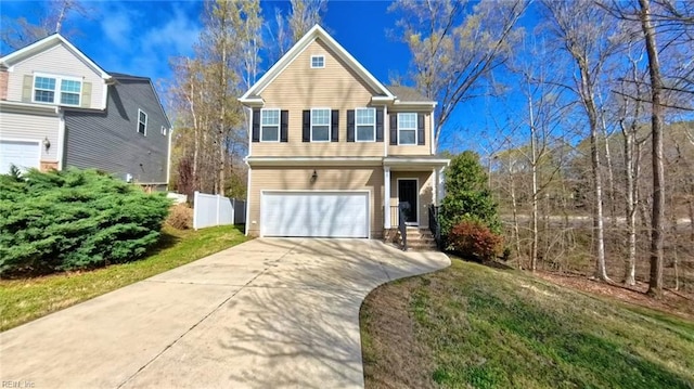 228 Bethune Dr, Williamsburg, VA 23185 - traditional-style house with an attached garage and concrete driveway