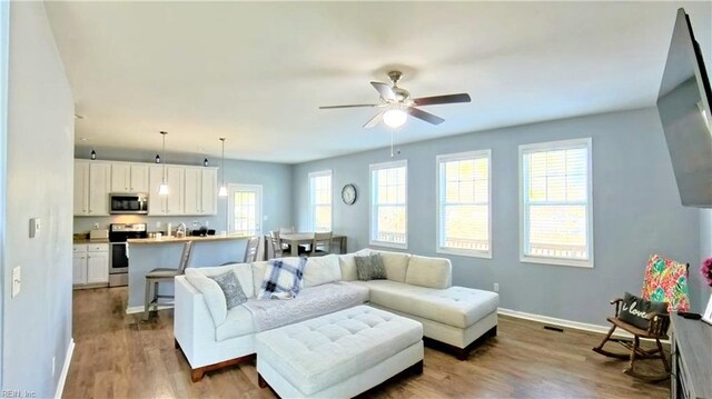 228 Bethune Dr, Williamsburg, VA 23185 - living room with wood finished floors, ceiling fan, and baseboards