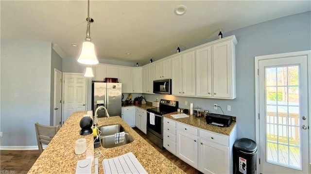 228 Bethune Dr, Williamsburg, VA 23185 - kitchen with appliances with stainless steel finishes, a sink, white cabinetry, dark wood finished floors, and decorative light fixtures