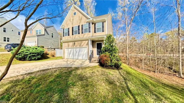 228 Bethune Dr, Williamsburg, VA 23185 - view of front facade with driveway, an attached garage, and a front lawn