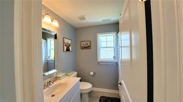 228 Bethune Dr, Williamsburg, VA 23185 - bathroom with toilet, vanity, and baseboards