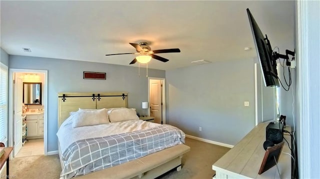 228 Bethune Dr, Williamsburg, VA 23185 - bedroom with light carpet, baseboards, ceiling fan, and ensuite bathroom