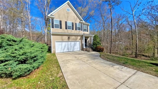 228 Bethune Dr, Williamsburg, VA 23185 - view of front of house with an attached garage and concrete driveway