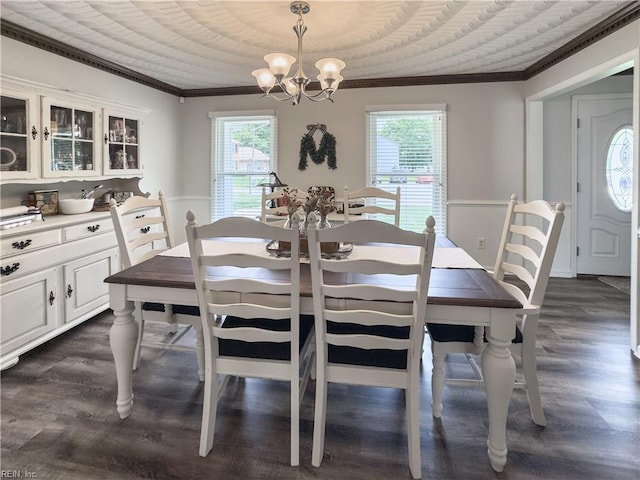 4657 Revere Dr, Virginia Beach, VA 23456 - dining area featuring crown molding, a chandelier, plenty of natural light, and dark wood-style flooring