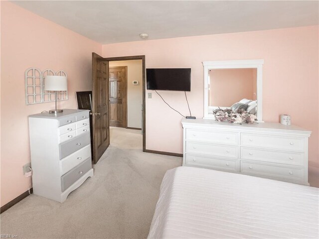4657 Revere Dr, Virginia Beach, VA 23456 - bedroom featuring light colored carpet and baseboards