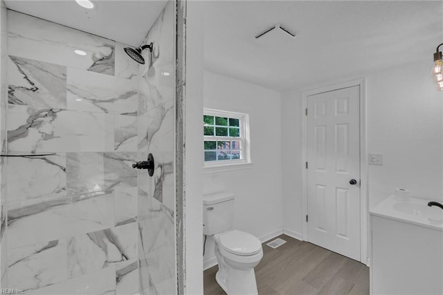 1604 Freeney Ave, Suffolk, VA 23434 - bathroom with vanity, toilet, a marble finish shower, and wood finished floors