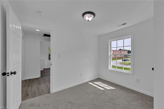 1604 Freeney Ave, Suffolk, VA 23434 - unfurnished room featuring carpet floors, baseboards, and a smoke detector