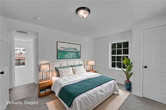 1604 Freeney Ave, Suffolk, VA 23434 - bedroom featuring carpet floors, multiple windows, and baseboards